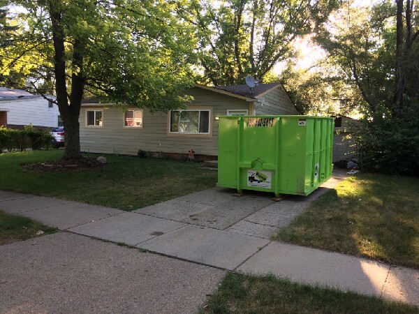 Dumpster Under Trees on Driveway Livonia MI